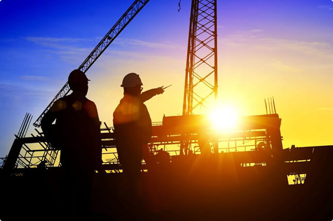 Construction Workers Pointing With Sunset